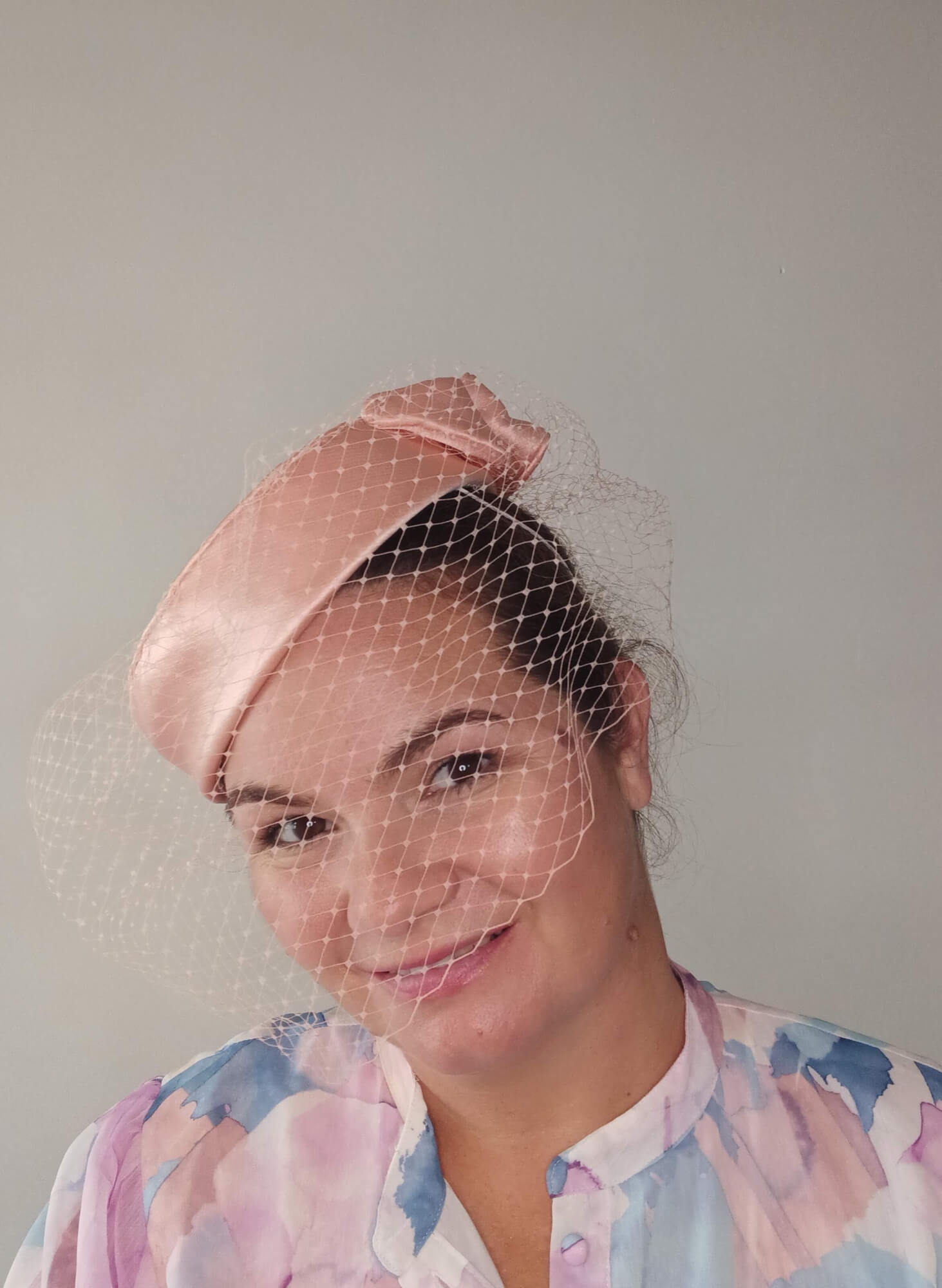 A picture of an Apricot Pillbox Hat  by Melissa Rath1 Millinery.
