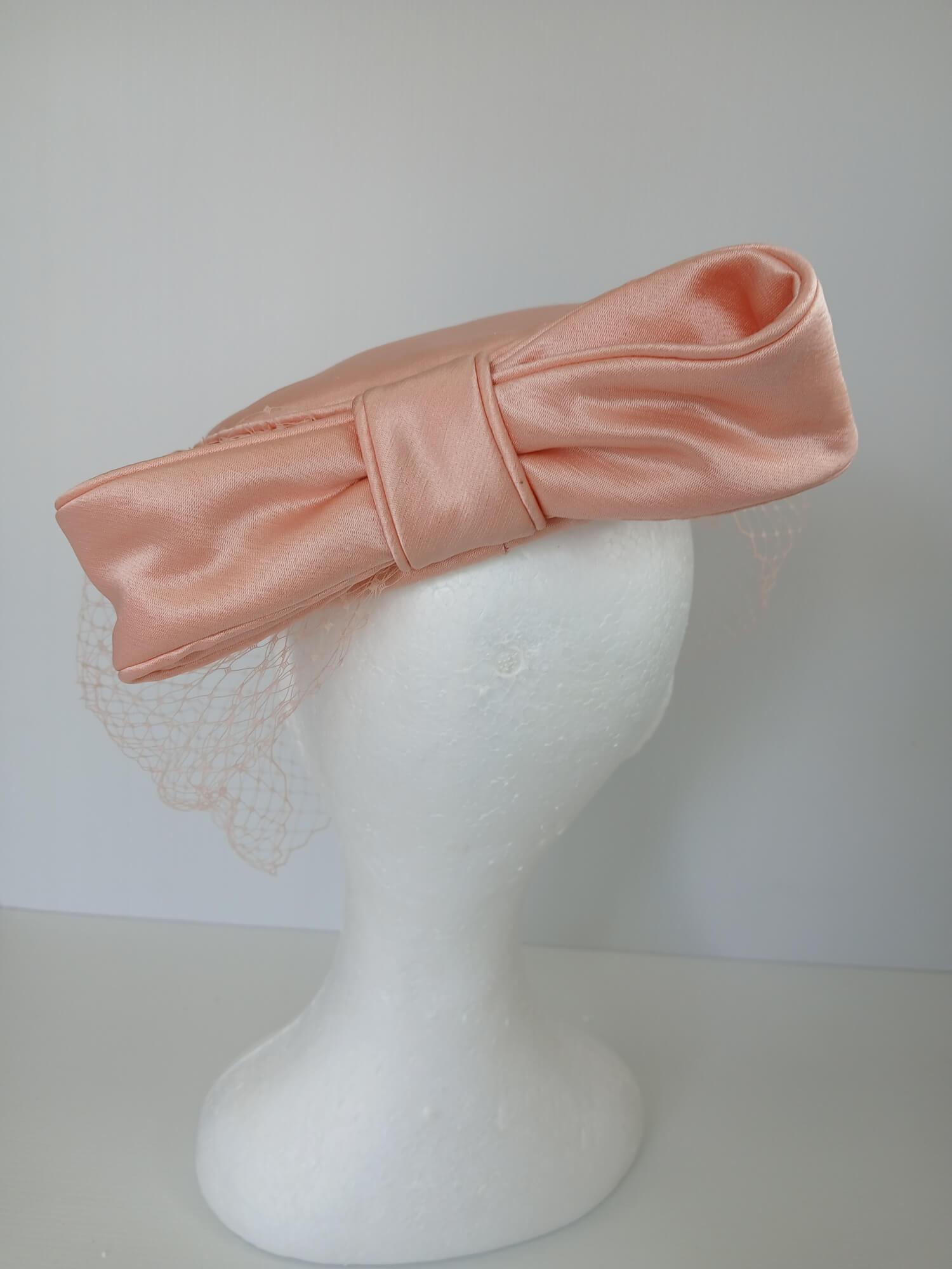 A picture of an Apricot Pillbox Hat  by Melissa Rath Millinery.