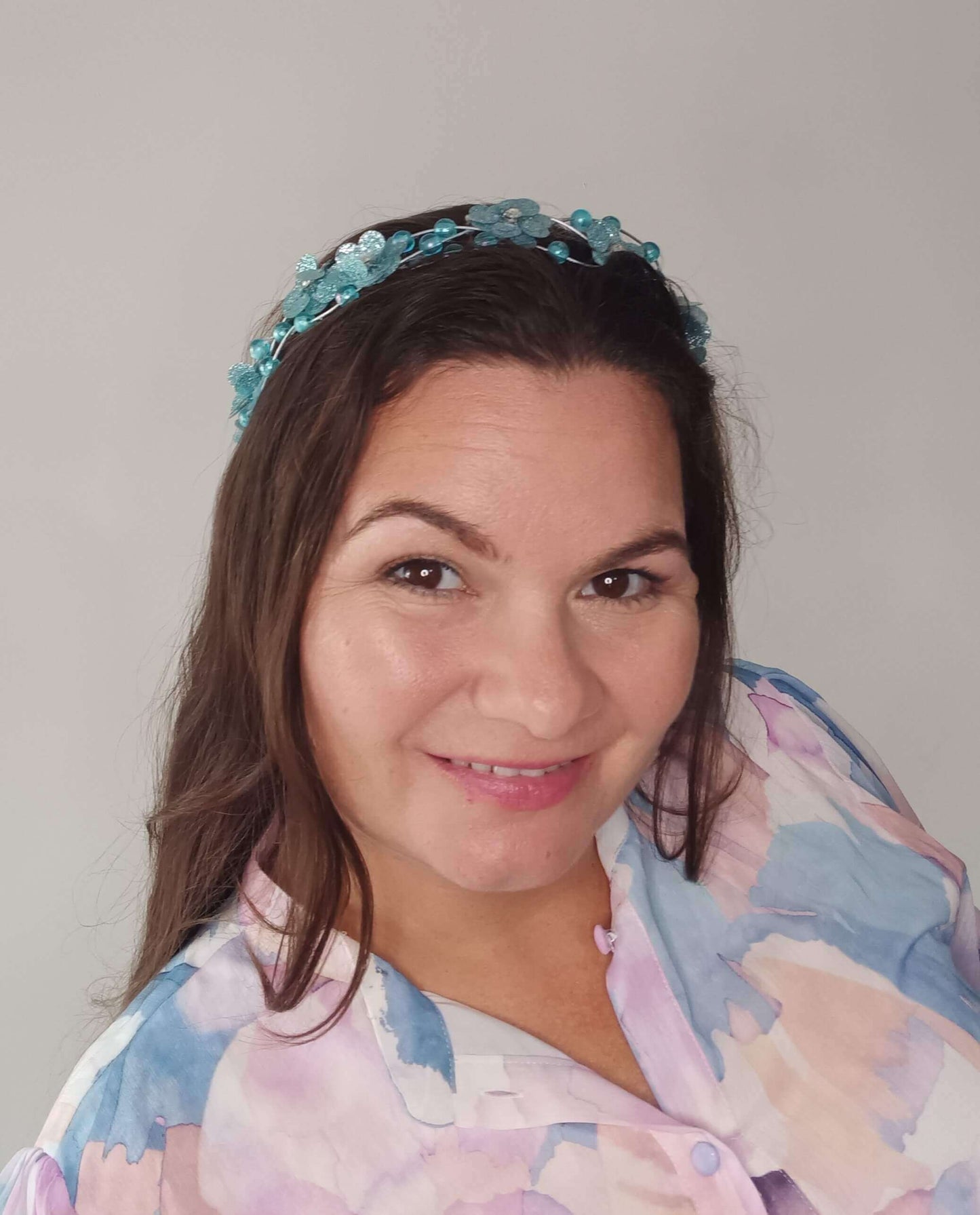 A picture of an Aqua Beaded Halo by Melissa Rath Millinery