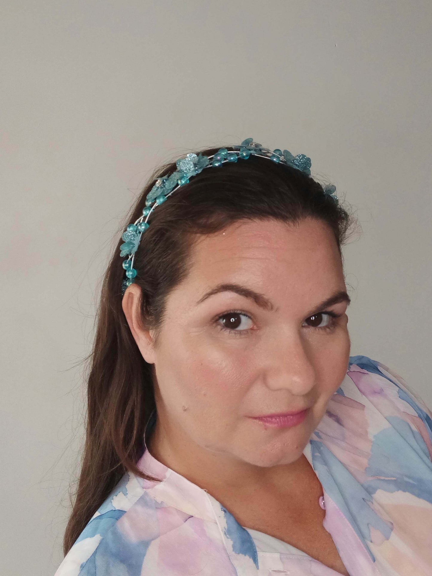 A picture of an Aqua Beaded Halo by Melissa Rath Millinery