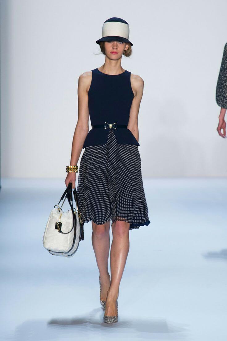 A picture of a model on the catwalk for Badgley Mischka SS 2014.