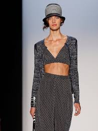 A picture of a model on the catwalk for Badgley Mischka SS 2014.