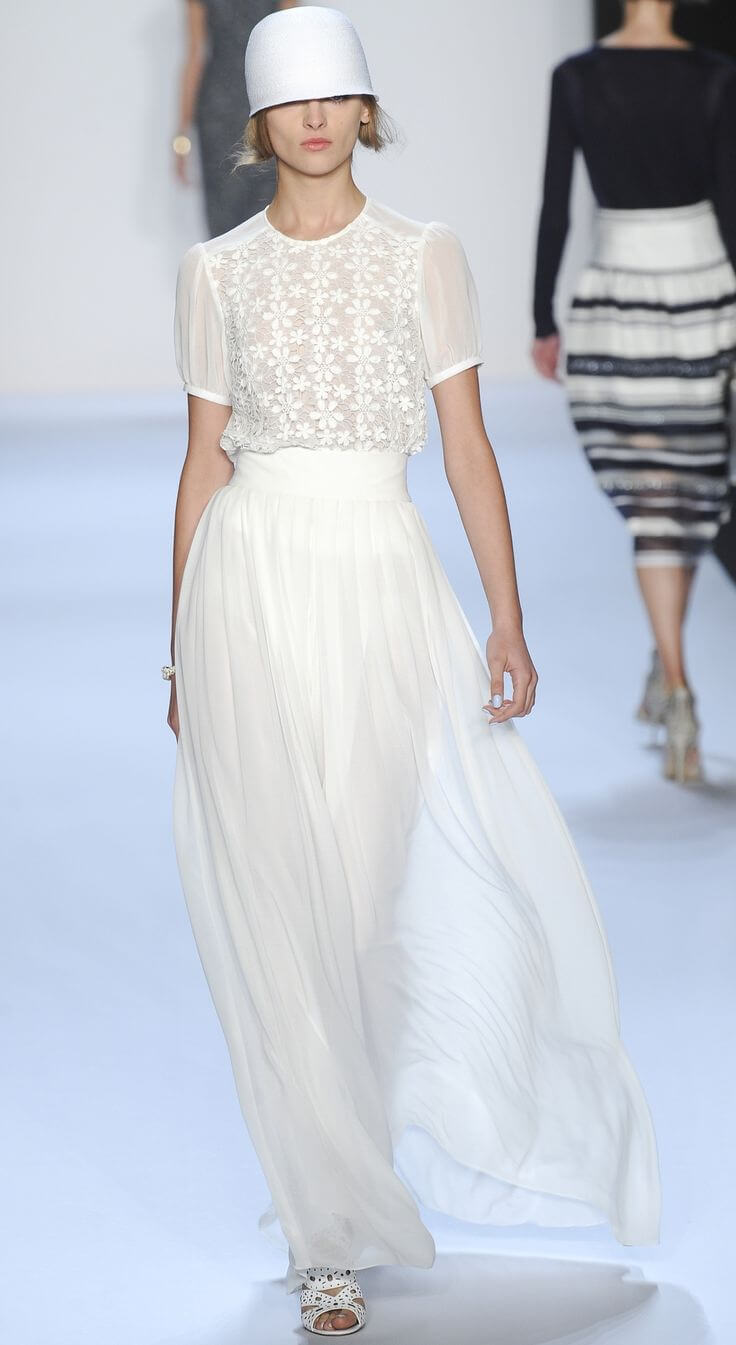 A picture of a model on the catwalk for Badgley Mischka FW 2022.