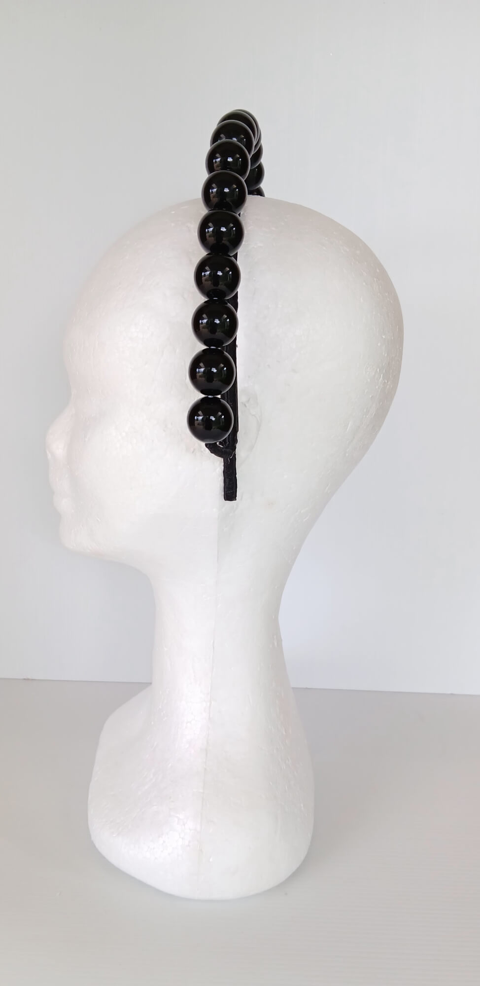 A picture of a Black Beaded Headband by Melissa Rath Millinery.