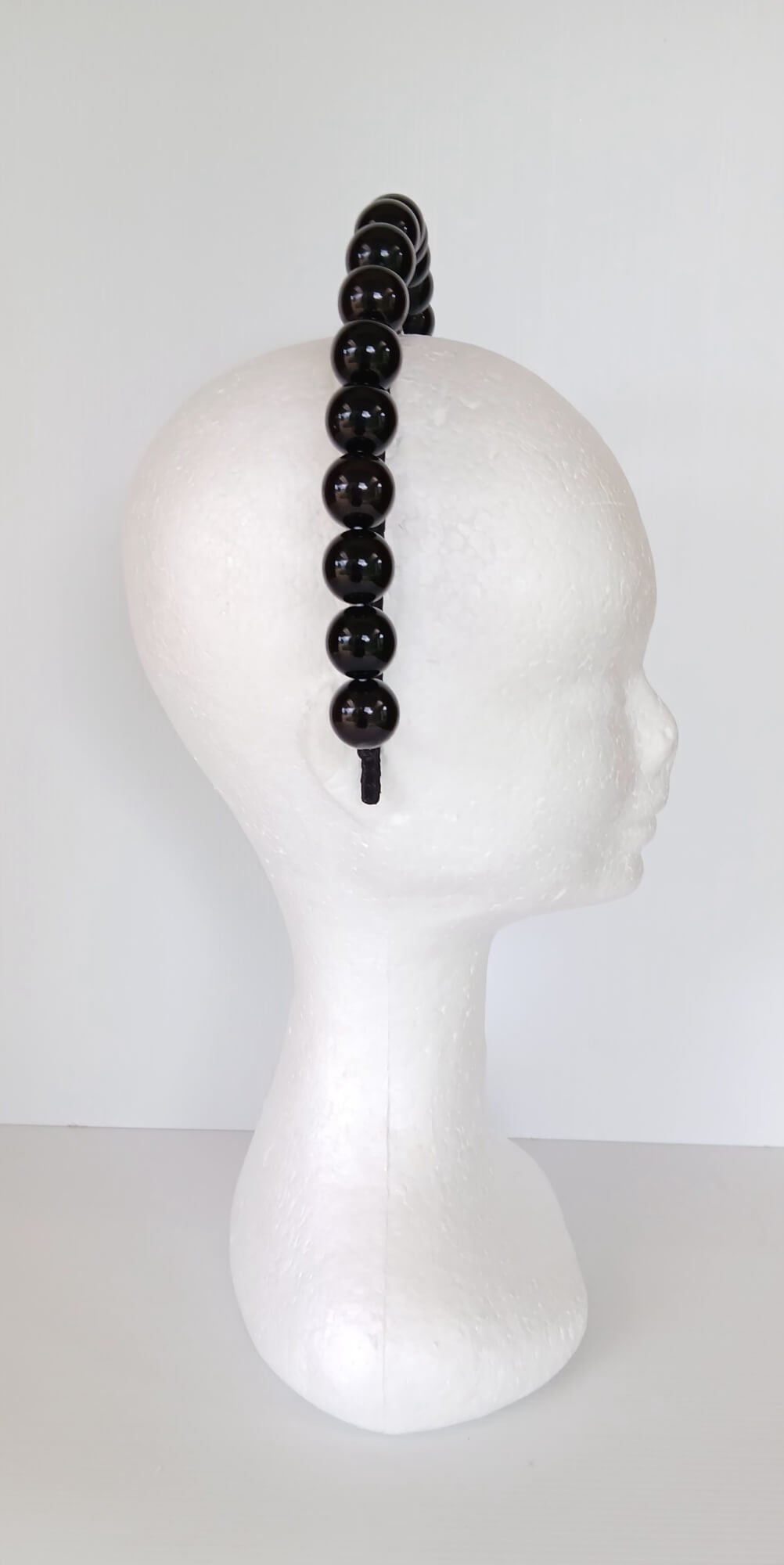 A picture of a Black Beaded Headband by Melissa Rath Millinery.