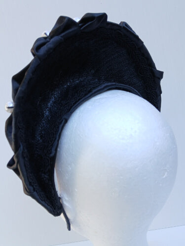 An image of a Black Smocked Satin Crown by Melissa Rath Millinery