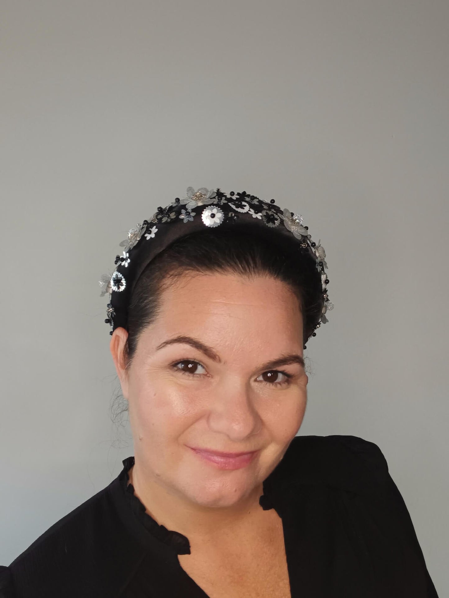 A picture of a Black, White and Silver Padded Headband by Melissa Rath Millinery.