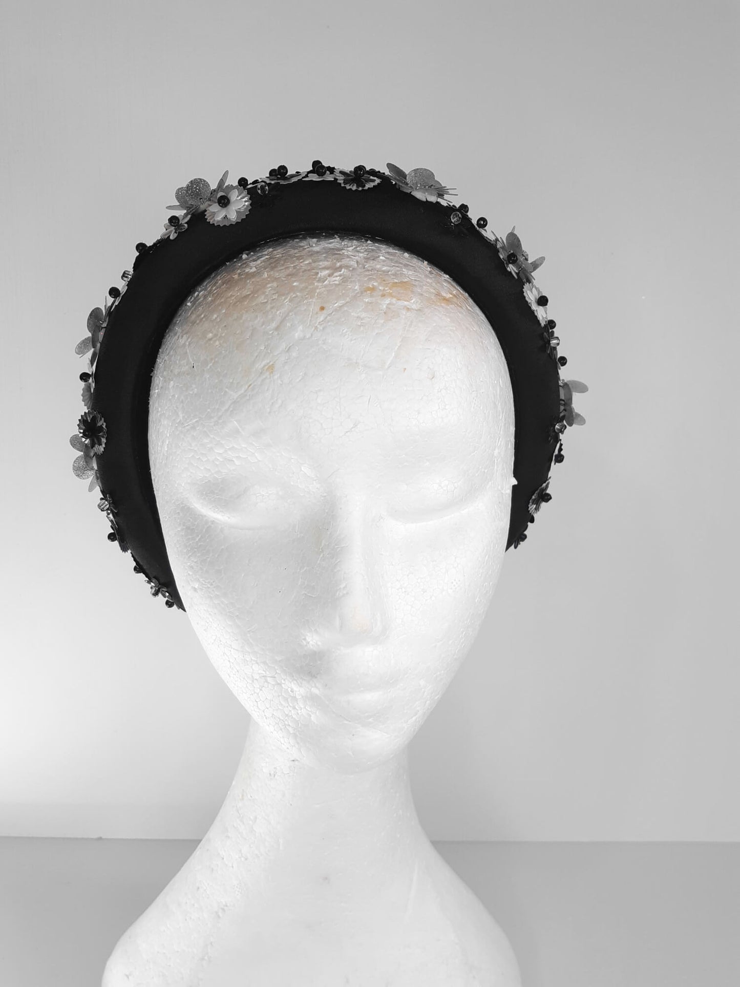 A picture of a Black, White and Silver Padded Headband by Melissa Rath Millinery.