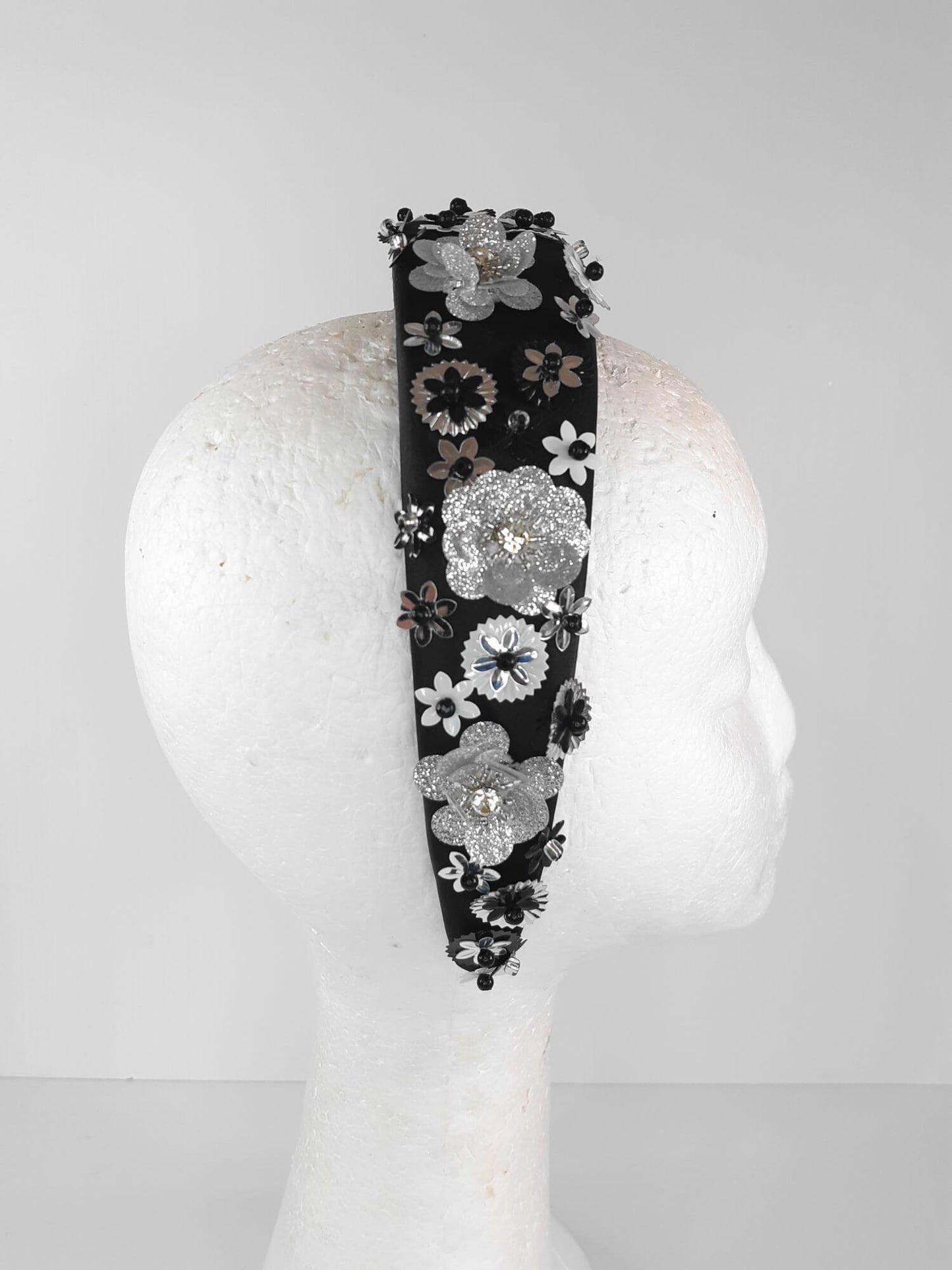 A picture of a Black, White and Silver Padded Headband by Melissa Rath Millinery.