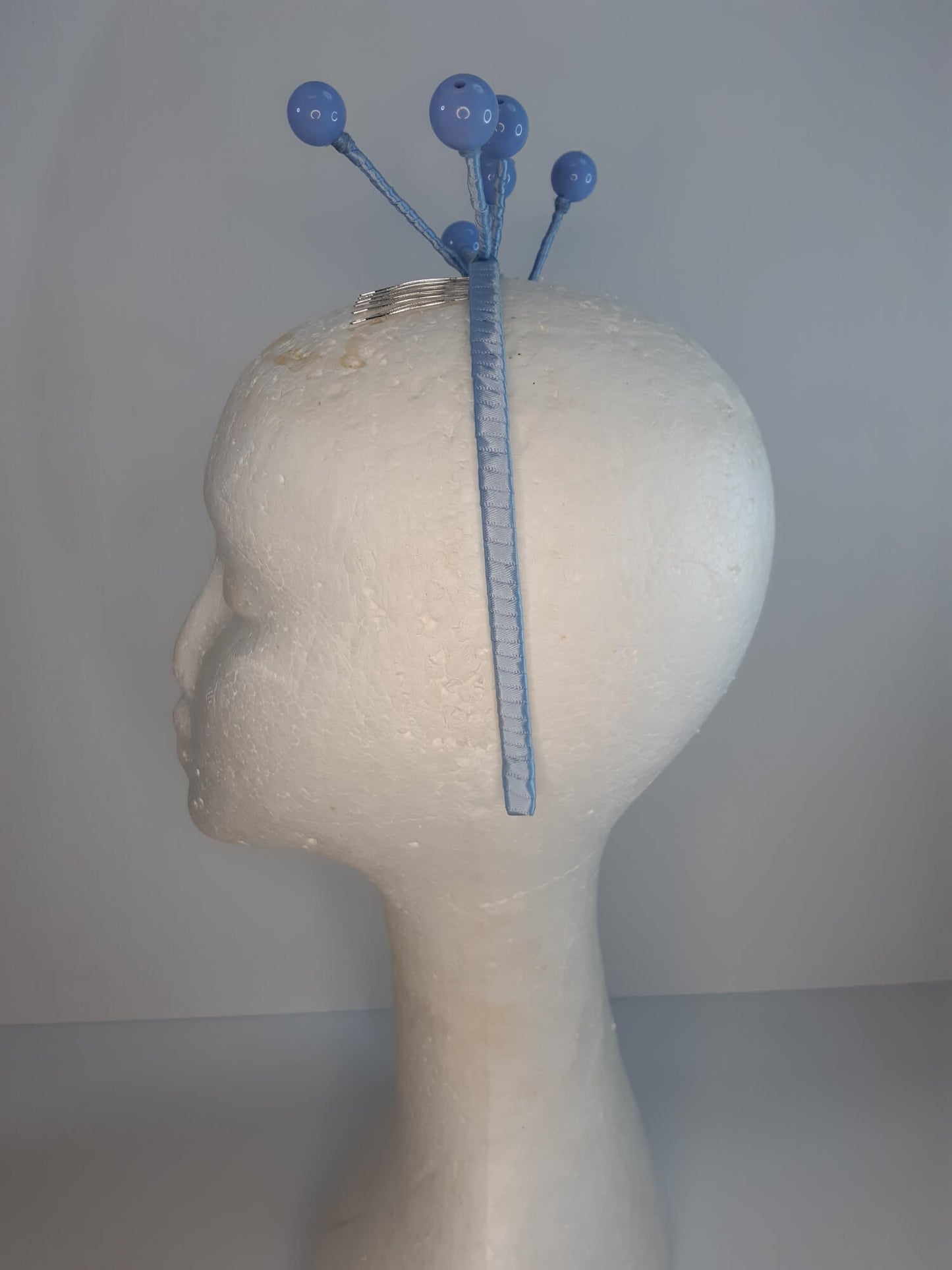 A picture of a Blue Beaded Headband by Melissa Rath Millinery.