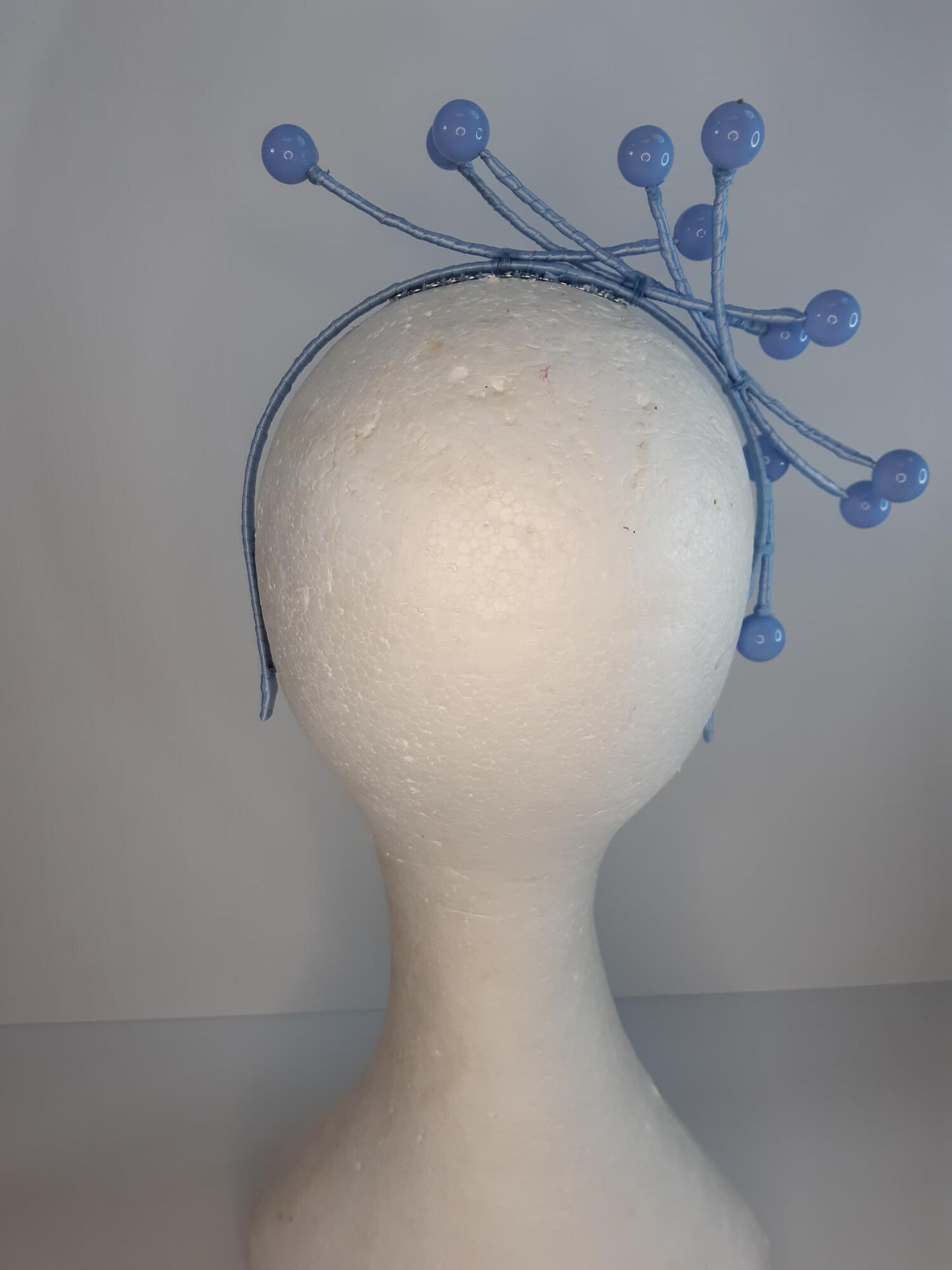 A picture of a Blue Beaded Headband by Melissa Rath Millinery.