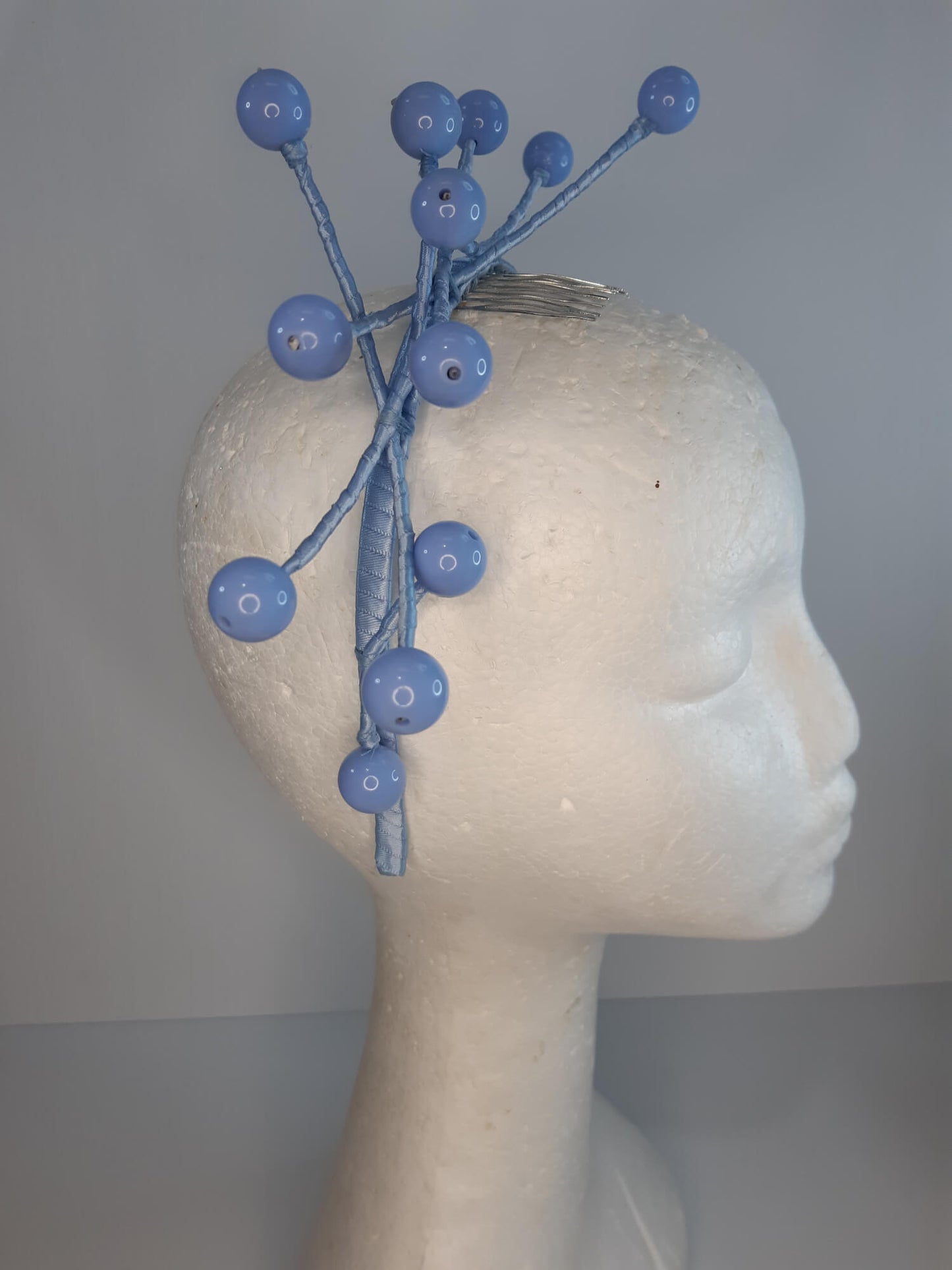 A picture of a Blue Beaded Headband by Melissa Rath Millinery.