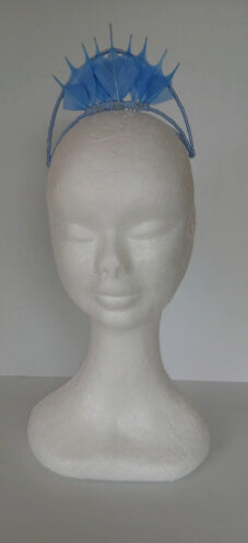 A picture of a blue feathered millinery crown by Melissa Rath Millinery.