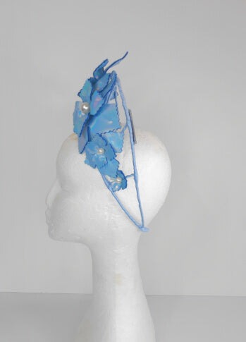 A picture of a Blue Pleather Millinery Crown by Melissa Rath Millinery.