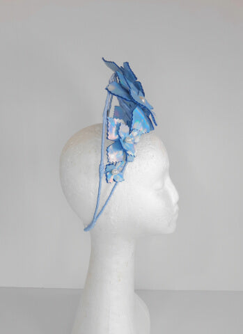 A picture of a Blue Pleather Millinery Crown by Melissa Rath Millinery.