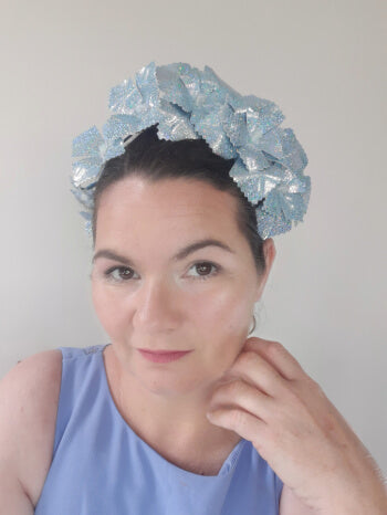 A picture of a blue pleather millinery crown by Melissa Rath Millinery.