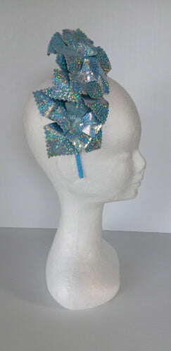 A picture of a blue pleather millinery crown by Melissa Rath Millinery.