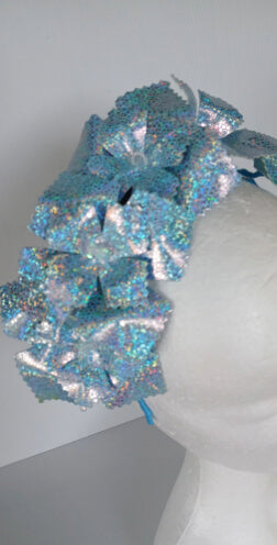 A picture of a blue pleather millinery crown by Melissa Rath Millinery.
