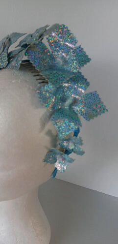 A picture of a blue pleather millinery crown by Melissa Rath Millinery.