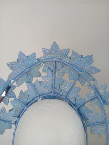 A picture is a Blue Pleather Millinery Crown by Melissa Rath Millinery.