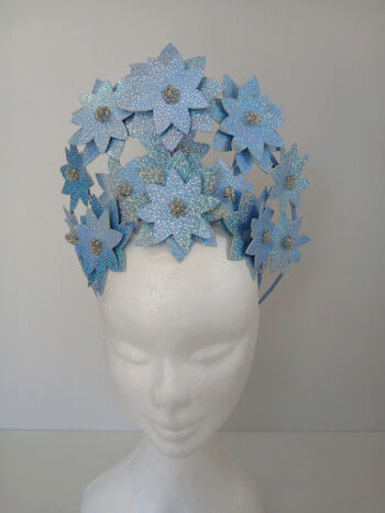 A picture is a Blue Pleather Millinery Crown by Melissa Rath Millinery.