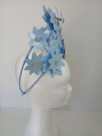 A picture is a Blue Pleather Millinery Crown by Melissa Rath Millinery.