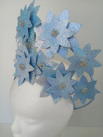 A picture is a Blue Pleather Millinery Crown by Melissa Rath Millinery.