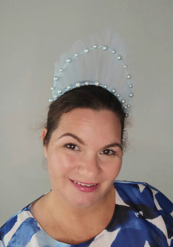 A picture of a light blue millinery crown by Melissa Rath Millinery.