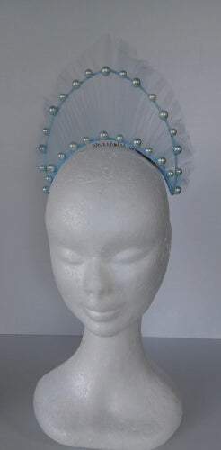 A picture of a light blue millinery crown by Melissa Rath Millinery.