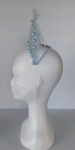 A picture of a light blue millinery crown by Melissa Rath Millinery.