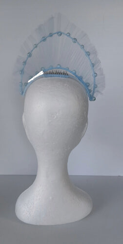 A picture of a light blue millinery crown by Melissa Rath Millinery.