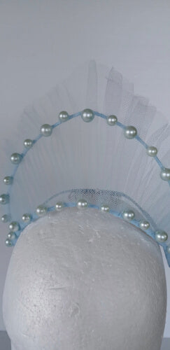 A picture of a light blue millinery crown by Melissa Rath Millinery.