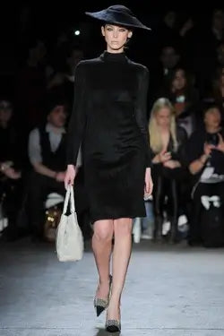 A picture of a model on the catwalk for  Christian Siriano FW 2014.