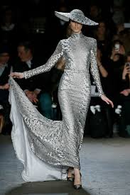 A picture of a model on the catwalk for  Christian Siriano FW 2014.