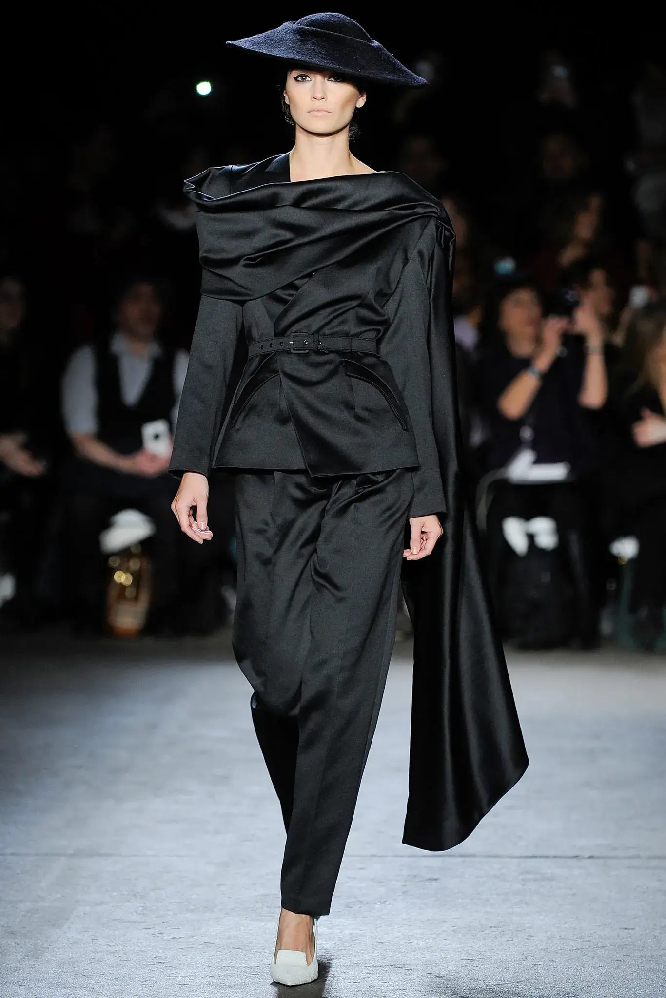 A picture of a model on the catwalk for  Christian Siriano FW 2014.