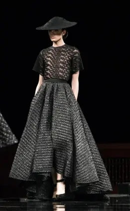 A picture of a model on the catwalk for  Christian Siriano FW 2014.