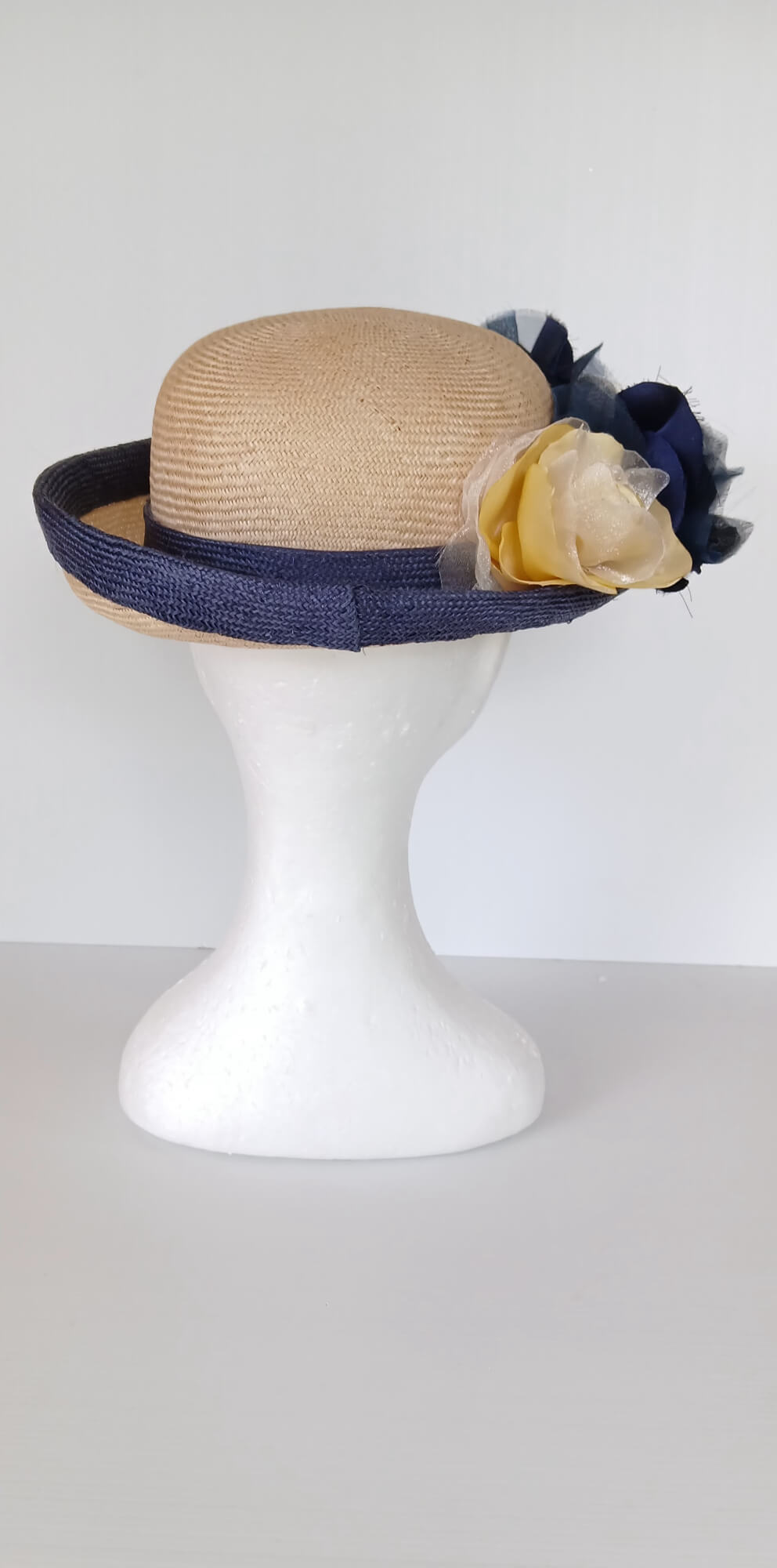 A picture of a Navy and Cream Parisisal Picture Hat by Melissa Rath Millinery.