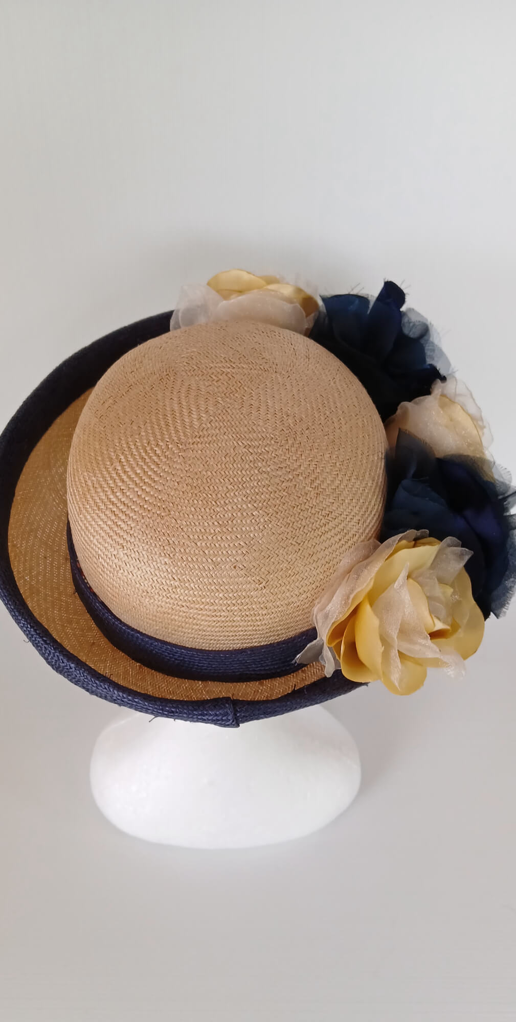 A picture of a Navy and Cream Parisisal Picture Hat by Melissa Rath Millinery.