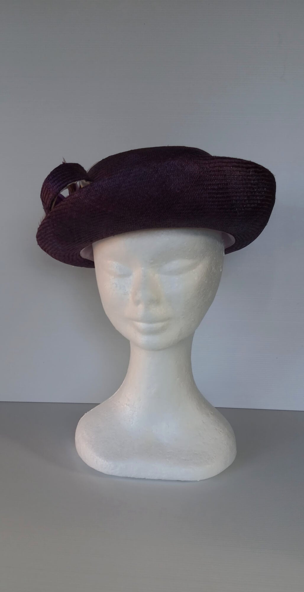 A picture of a Dark Purple Parisisal Picture Hat by Melissa Rath Millinery.
