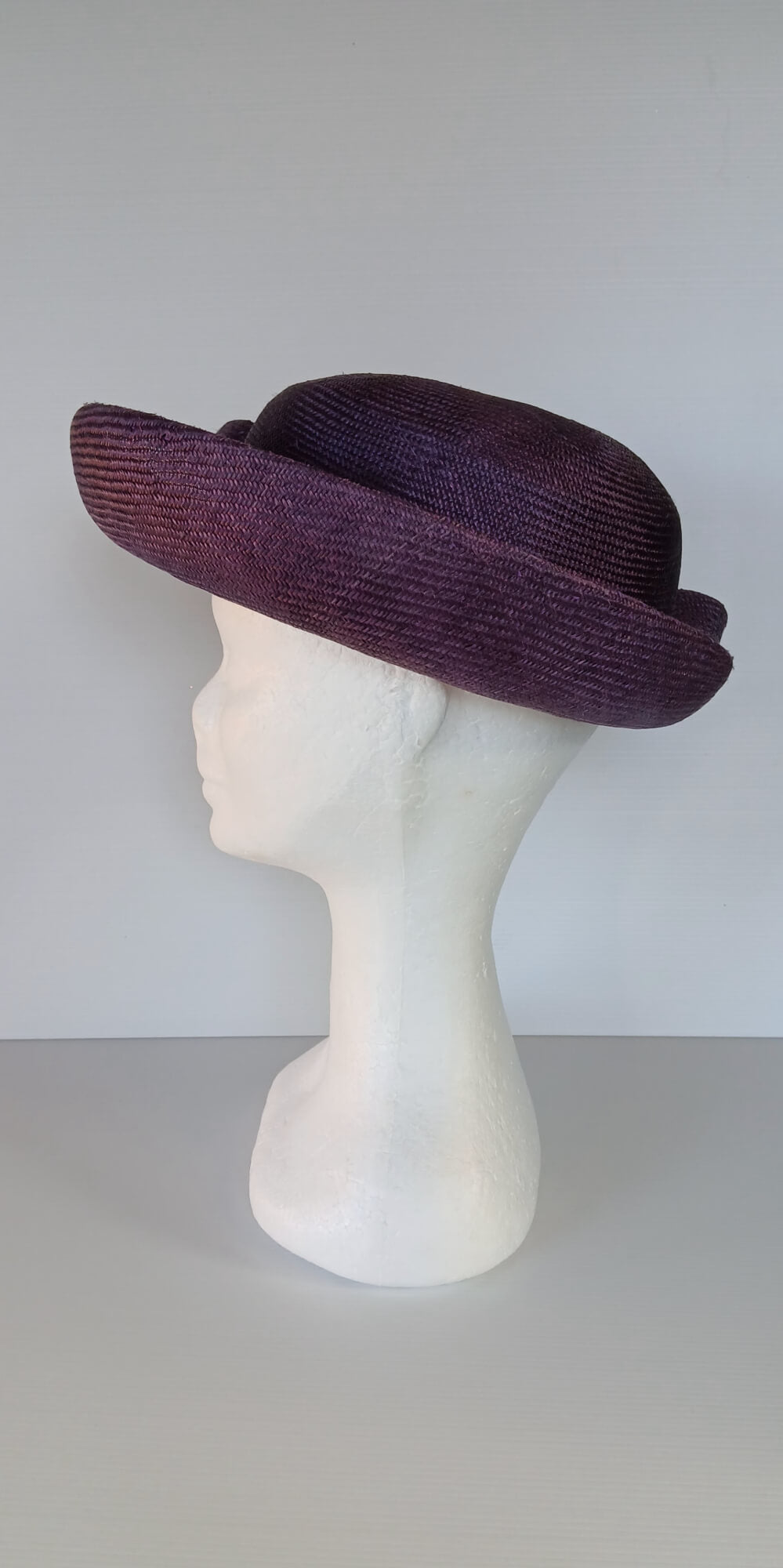 A picture of a Dark Purple Parisisal Picture Hat by Melissa Rath Millinery.