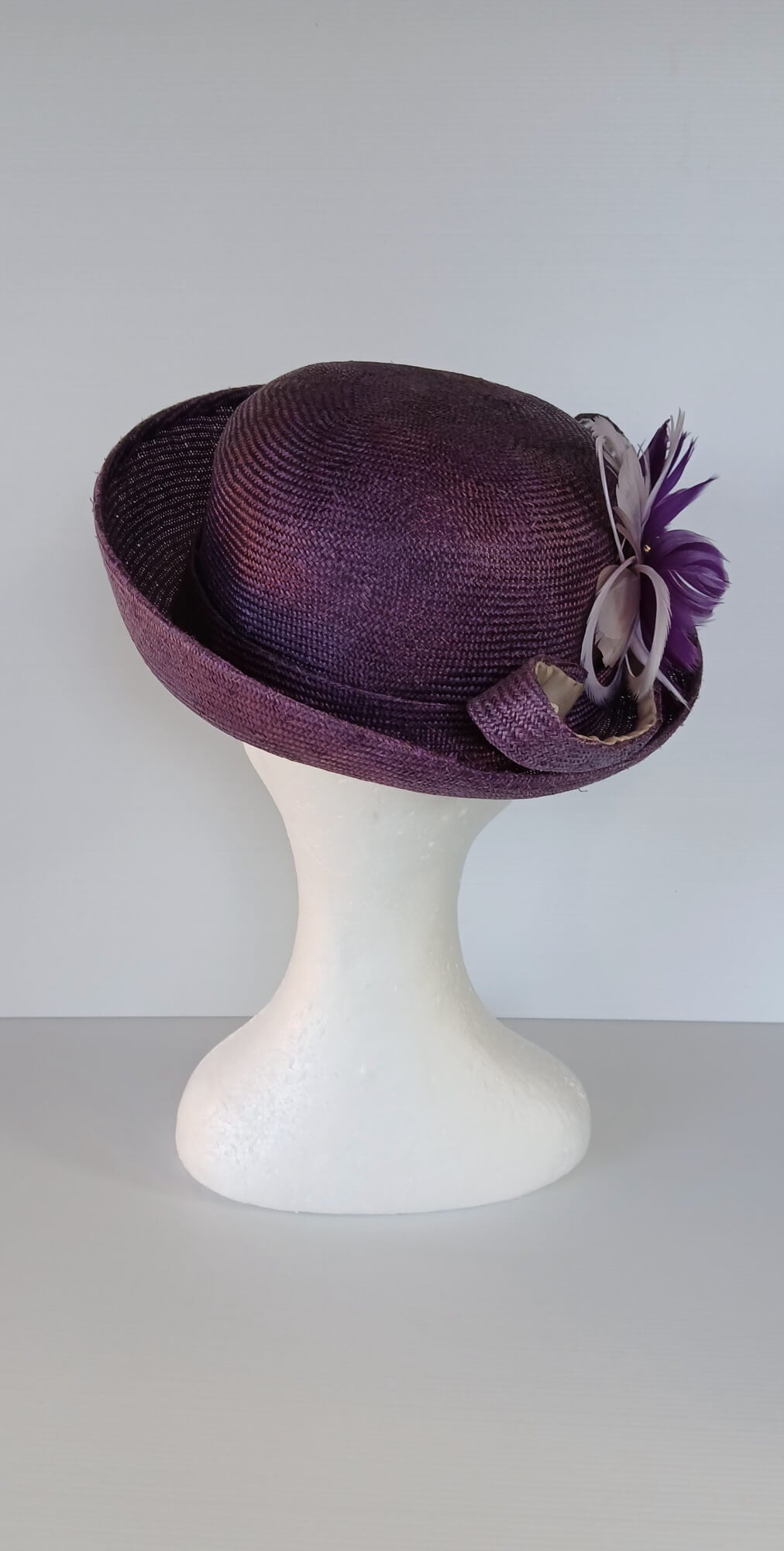 A picture of a Dark Purple Parisisal Picture Hat by Melissa Rath Millinery.