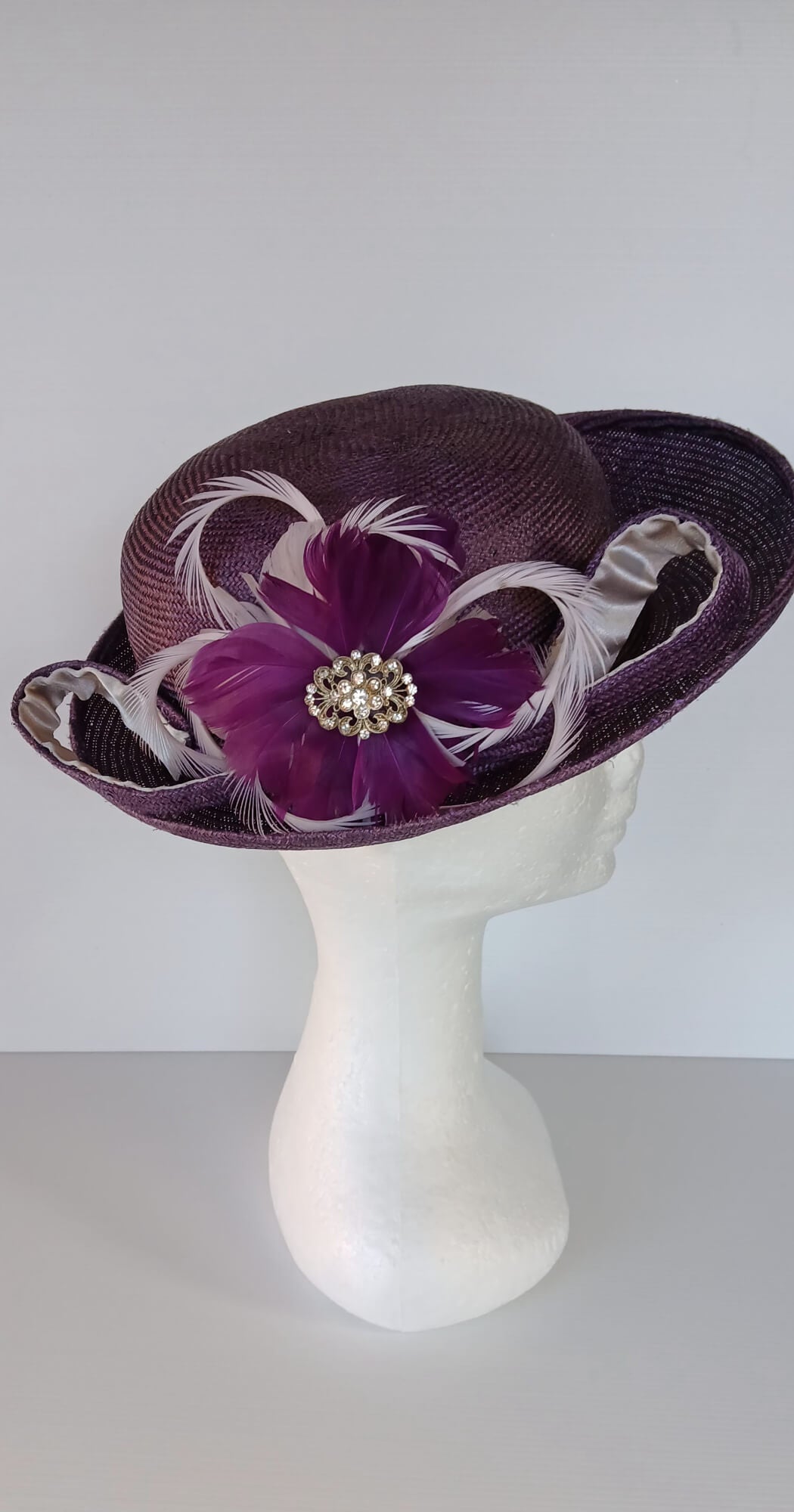 A picture of a Dark Purple Parisisal Picture Hat by Melissa Rath Millinery.