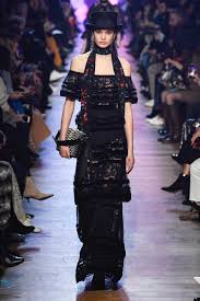 A picture of a model on the catwalk for Elie Saab AW 2018.