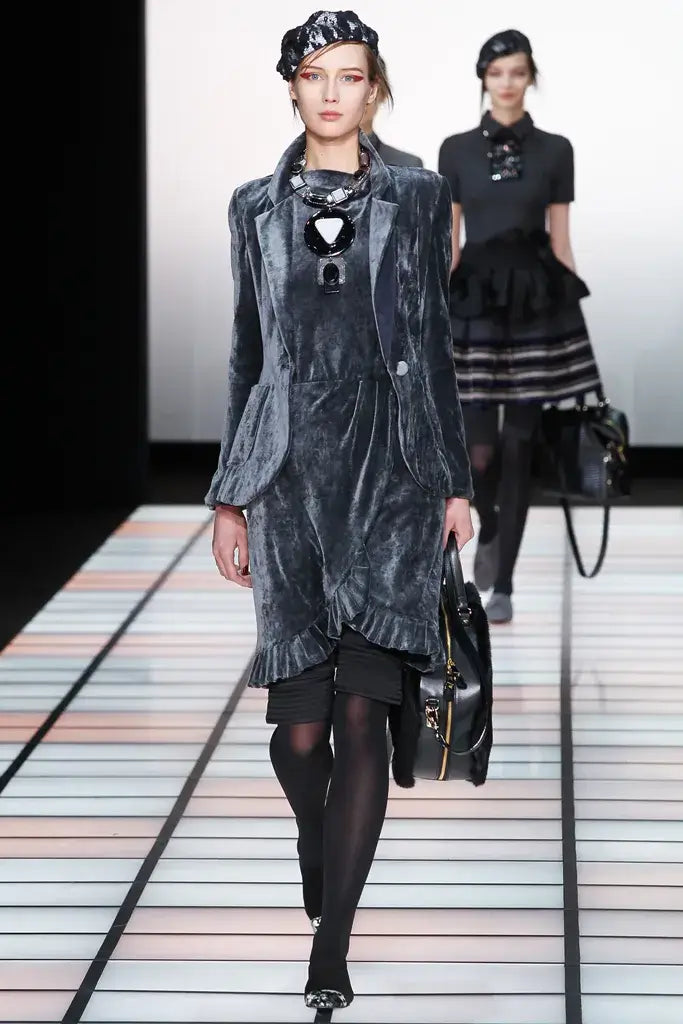 A picture of a model on the catwalk for  Emporio Armani AW 2012.
