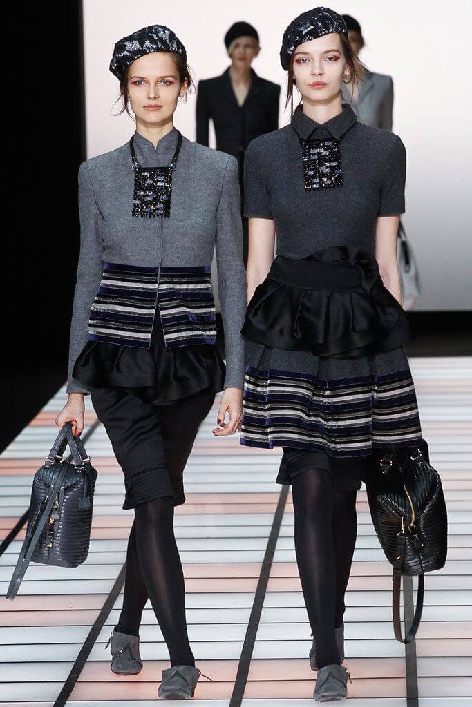 A picture of models on the catwalk for  Emporio Armani AW 2012.