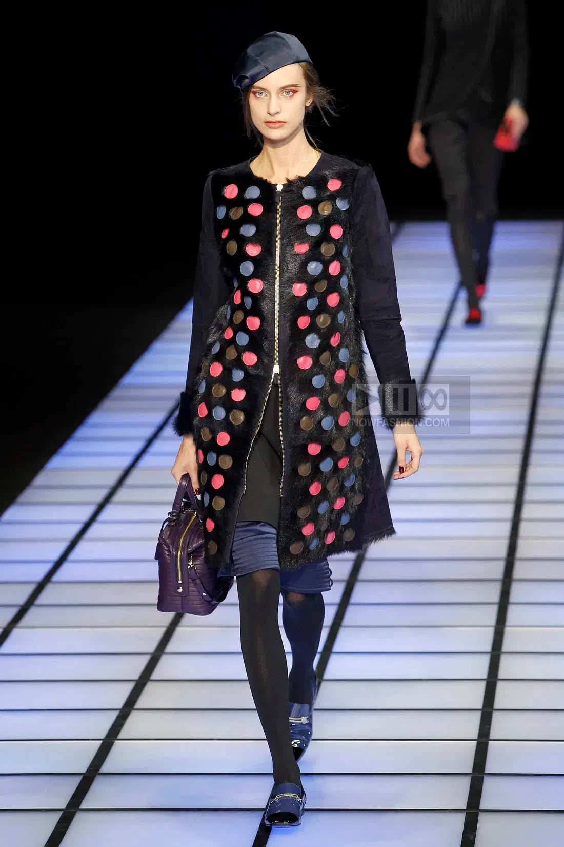 A picture of a model on the catwalk for  Emporio Armani AW 2012.