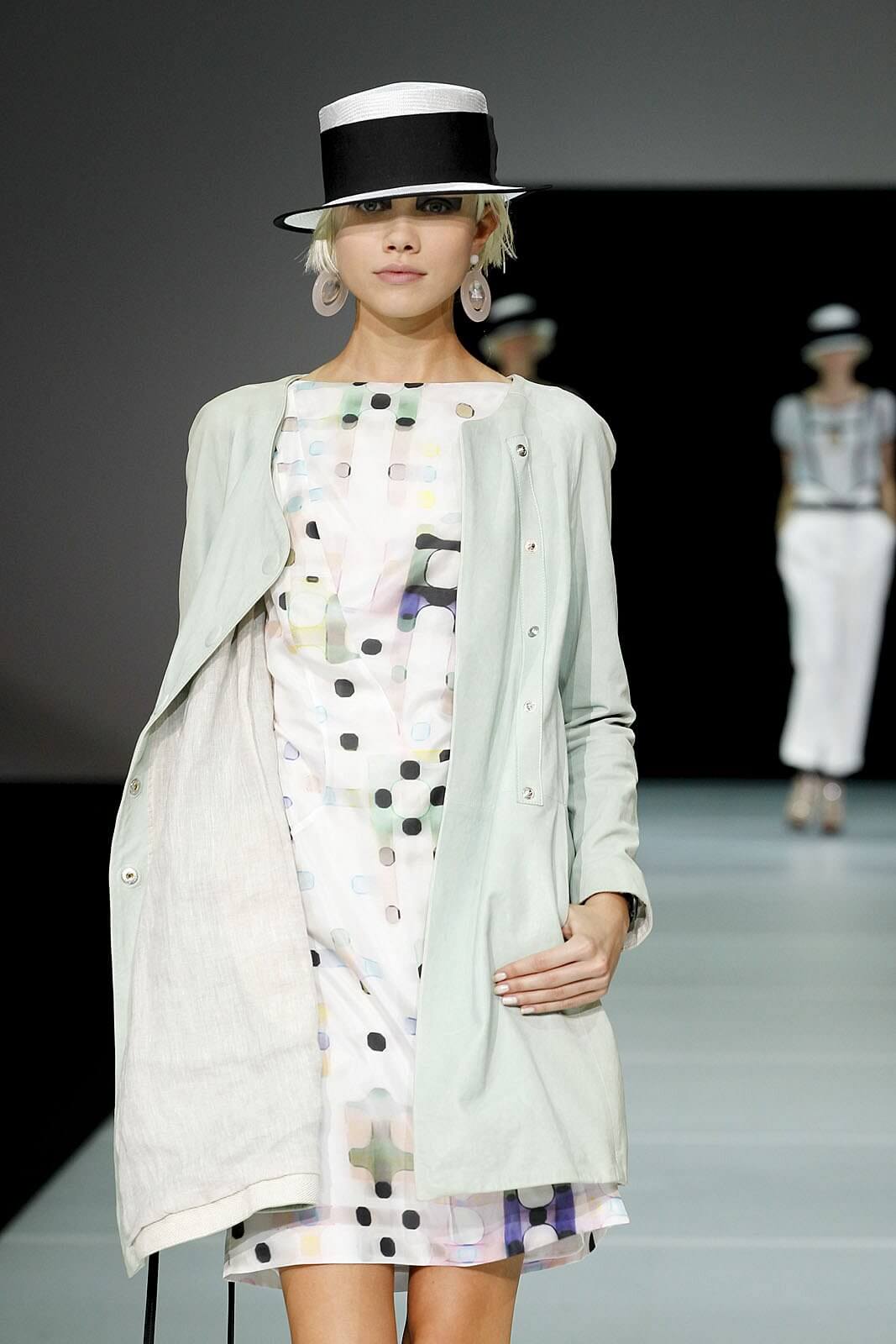 A picture of a model on the catwalk for  Emporio Armani SS 2012.