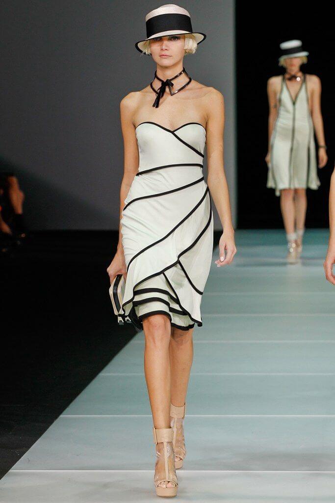 A picture of a model on the catwalk for  Emporio Armani SS 2012.