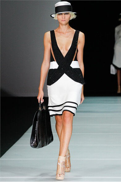 A picture of a model on the catwalk for  Emporio Armani SS 2012.