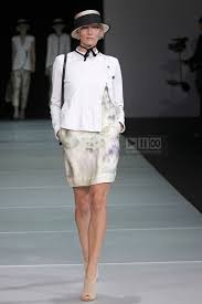 A picture of a model on the catwalk for  Emporio Armani SS 2012.